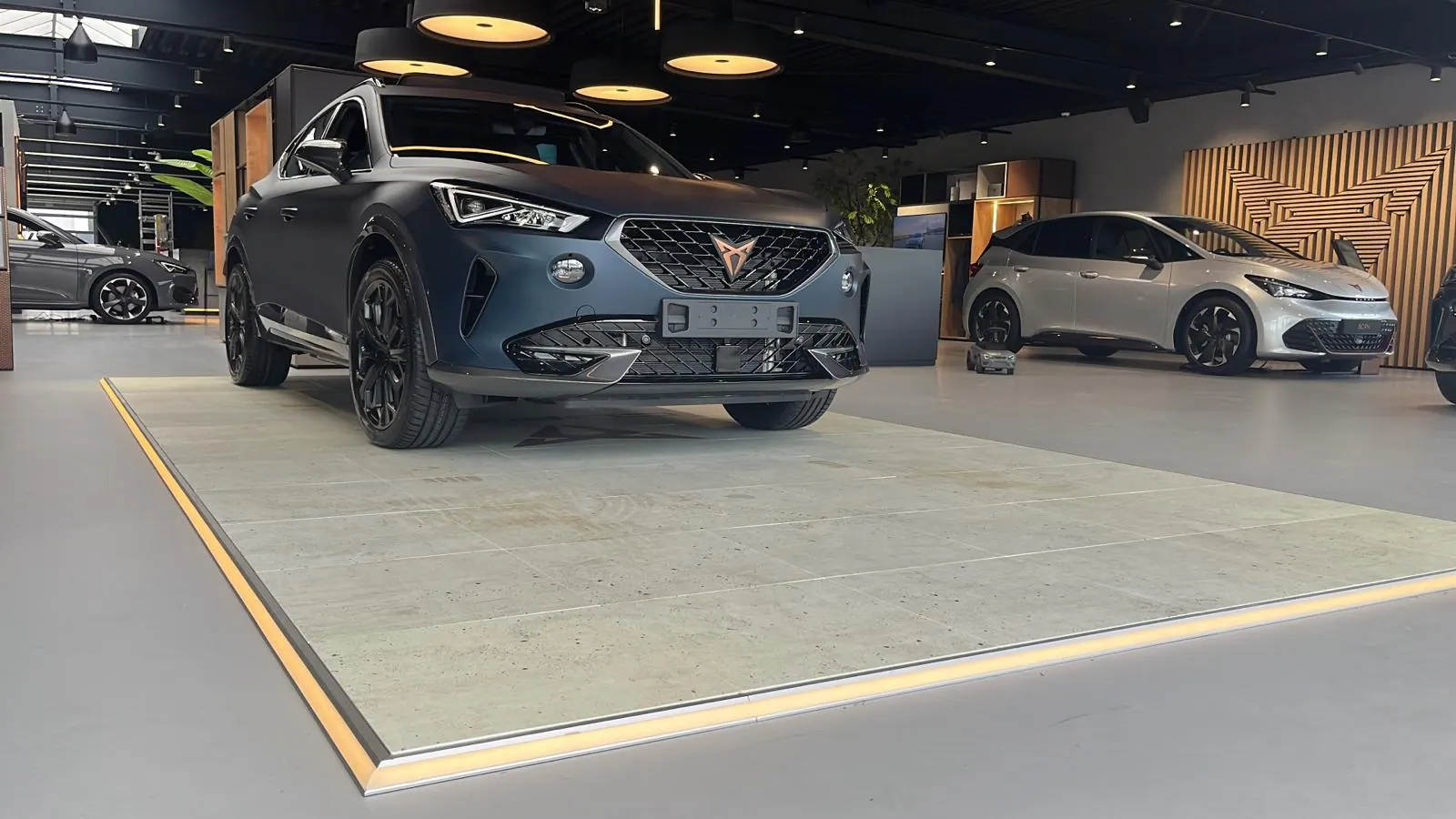 Cupra — Concrete look with gold LED edge, showroom